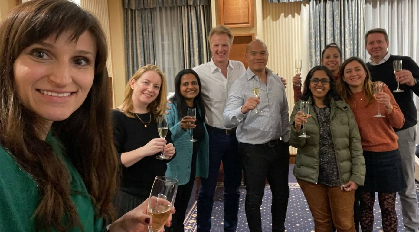 Atombit and Amplify Analytix colleagues raising a toast